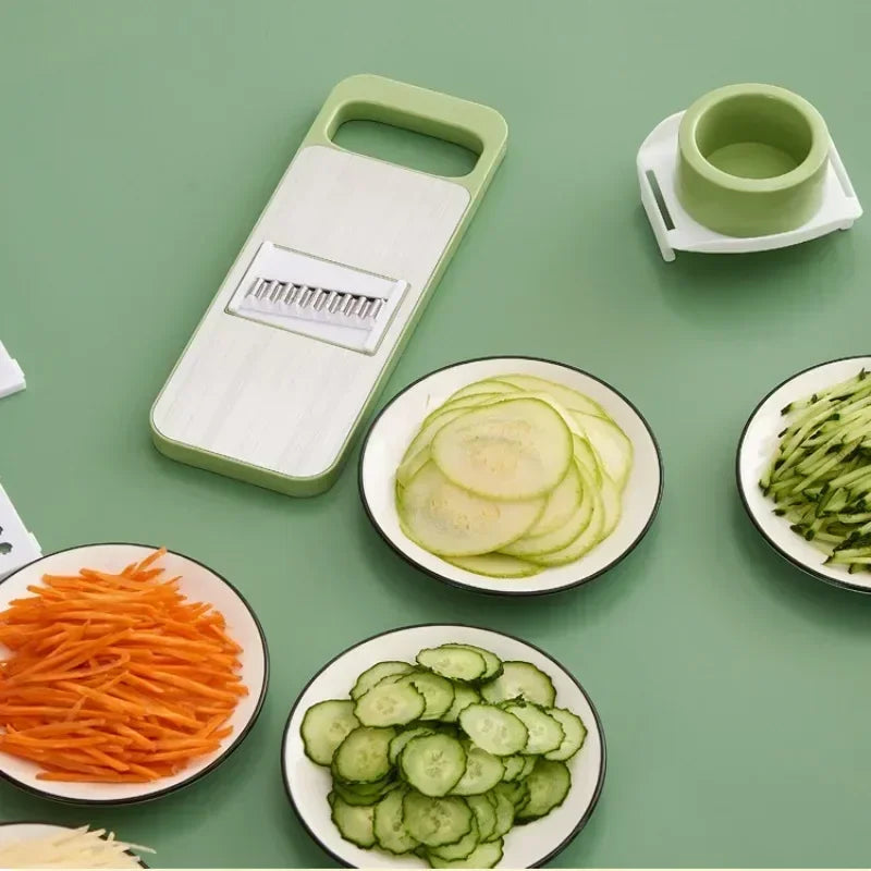 FusionCharm 5-in-1 vegetable cutter kitchen set with stainless steel slicer, showing various blades for chopping and slicing vegetables.